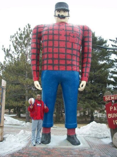 Scooter Christensen, star of the famous Harlem Globetrotters, visited statues of Paul and Babe in advance of the Globetrotters' performance at The Sanford Center in 2011.