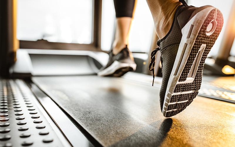 woman walking a treadmill