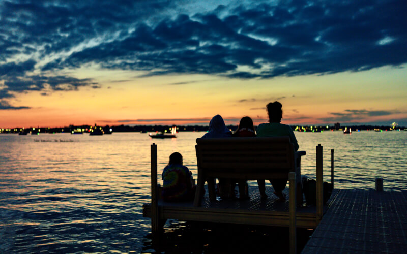 family at sunset dock